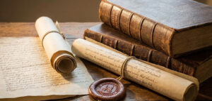 Close-up of 13th-century parchment scrolls, leather-bound parish records, and a wax seal from the St Andrew’s Biggleswade archive.